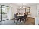 Bright dining area with a chandelier and access to a balcony at 36750 Us Highway 19 N # 13202, Palm Harbor, FL 34684