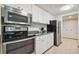 Modern kitchen features stainless steel appliances and granite countertops at 36750 Us Highway 19 N # 13202, Palm Harbor, FL 34684