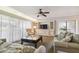 Bright living room with comfy sofas, a coffee table, and built-in shelving at 36750 Us Highway 19 N # 13202, Palm Harbor, FL 34684