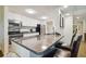 Granite countertop kitchen island with breakfast bar seating at 36750 Us Highway 19 N # 13202, Palm Harbor, FL 34684