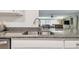 Kitchen features granite countertops and stainless steel sink at 36750 Us Highway 19 N # 13202, Palm Harbor, FL 34684
