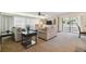 Living room offers comfortable seating and access to a balcony at 36750 Us Highway 19 N # 13202, Palm Harbor, FL 34684