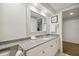 Bathroom with granite vanity and large mirror at 36750 Us Highway 19 N # 13202, Palm Harbor, FL 34684