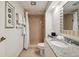 Clean bathroom with shower/tub combo, granite vanity, and tiled flooring at 36750 Us Highway 19 N # 13202, Palm Harbor, FL 34684