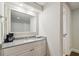 Small bathroom with granite vanity and coffee maker at 36750 Us Highway 19 N # 13202, Palm Harbor, FL 34684