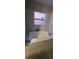 Bathroom showcasing a tub with tiled surround and a window for natural light at 2312 22Nd Sw Ave, Largo, FL 33774