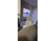 Bathroom showcasing a tub with tiled surround and a window for natural light at 2312 22Nd Sw Ave, Largo, FL 33774
