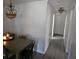 Dining room features a decorative chandelier over the dining table and access to the hallway at 2312 22Nd Sw Ave, Largo, FL 33774