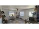 Bright living room with an eat-in bar, plenty of natural light, and stylish furnishings at 2312 22Nd Sw Ave, Largo, FL 33774