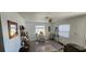 Open living room with natural light, neutral decor, and tile floors; adjacent to a breakfast bar at 2312 22Nd Sw Ave, Largo, FL 33774