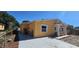 Yellow house with driveway and side yard at 2312 22Nd Sw Ave, Largo, FL 33774