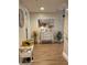 Whitewashed bench and dresser accent a spacious entryway at 36750 Us Highway 19 N # 21-302, Palm Harbor, FL 34684