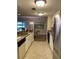 Well-lit kitchen with granite countertops and stainless steel appliances at 36750 Us Highway 19 N # 21-302, Palm Harbor, FL 34684