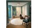 Entryway with white rug and wooden chairs at 36750 Us Highway 19 N # 21-302, Palm Harbor, FL 34684