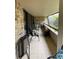 Spacious balcony with seating and brick wall at 36750 Us Highway 19 N # 21-302, Palm Harbor, FL 34684