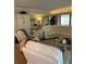 Spacious living room with sectional sofa and large windows at 36750 Us Highway 19 N # 21-302, Palm Harbor, FL 34684