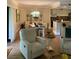 Living room with comfortable seating and wood flooring at 36750 Us Highway 19 N # 21-302, Palm Harbor, FL 34684