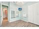 Neutral bedroom features a closet and an open doorway to a hall at 131 Pennsylvania Ave, Palm Harbor, FL 34683