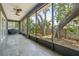 Screened lanai featuring tile floors offers tranquil outdoor living space at 131 Pennsylvania Ave, Palm Harbor, FL 34683