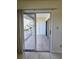 View from the balcony with sliding glass doors and tile flooring at 6802 Stones Throw N Cir # 14206, St Petersburg, FL 33710