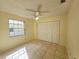 Cozy bedroom featuring a ceiling fan, neutral paint, and a spacious closet at 6802 Stones Throw N Cir # 14206, St Petersburg, FL 33710