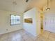 Bright dining room featuring tile floors and a window offering plenty of natural light at 6802 Stones Throw N Cir # 14206, St Petersburg, FL 33710