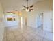 Expansive living room with tile floors, a ceiling fan, and an open layout for comfortable living and entertaining at 6802 Stones Throw N Cir # 14206, St Petersburg, FL 33710