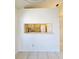 View of the kitchen from a sunlit living space, creating an open and inviting area for relaxation and dining at 6802 Stones Throw N Cir # 14206, St Petersburg, FL 33710