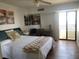 Bright bedroom with a queen-size bed and balcony access at 830 S Gulfview Blvd # 601, Clearwater Beach, FL 33767