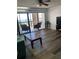 Living room with balcony access, wood-look floors, and view of the water at 830 S Gulfview Blvd # 601, Clearwater Beach, FL 33767