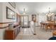 Bright entryway with wood flooring and views into the dining area at 4936 Mineola Pl, Palm Harbor, FL 34684