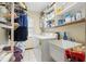 Laundry room with washer, dryer, and utility sink at 4936 Mineola Pl, Palm Harbor, FL 34684