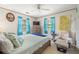 Relaxing bedroom with a ceiling fan and large windows at 4936 Mineola Pl, Palm Harbor, FL 34684