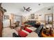 Living room with ample seating and access to the backyard at 4936 Mineola Pl, Palm Harbor, FL 34684
