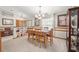 Bright dining room featuring a built-in hutch and chandelier at 4936 Mineola Pl, Palm Harbor, FL 34684