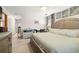 Main bedroom with large bed and ensuite access at 4936 Mineola Pl, Palm Harbor, FL 34684