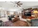 Comfortable living room with dark leather furniture and area rug at 4936 Mineola Pl, Palm Harbor, FL 34684