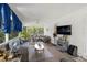 Relaxing screened porch with wicker furniture and TV at 4936 Mineola Pl, Palm Harbor, FL 34684
