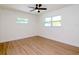 Light-filled bedroom with ceiling fan and wood-look floors at 9197 79Th Ave, Seminole, FL 33777