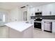 Modern kitchen with stainless steel appliances and white shaker cabinets at 9197 79Th Ave, Seminole, FL 33777