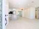 Open concept kitchen with island, modern appliances and white cabinets at 9197 79Th Ave, Seminole, FL 33777