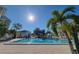 Community swimming pool with surrounding patio and lounge chairs at 6802 Stones Throw N Cir # 14206, St Petersburg, FL 33710