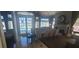 Elegant community room with fireplace, dining area, and pool view at 2201 Bay Club Cir, Tampa, FL 33607