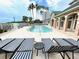 Resort-style pool with striped lounge chairs at 2201 Bay Club Cir, Tampa, FL 33607