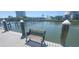 Wooden dock with bench overlooking the water at 2201 Bay Club Cir, Tampa, FL 33607