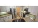 Modern kitchen featuring granite countertops and stainless steel appliances at 2201 Bay Club Cir, Tampa, FL 33607