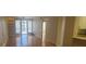 Bright living room with hardwood floors and access to a balcony at 2201 Bay Club Cir, Tampa, FL 33607