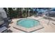 Relaxing hot tub surrounded by lush landscaping at 2201 Bay Club Cir, Tampa, FL 33607