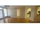 Bright living room with hardwood floors and view into kitchen at 2201 Bay Club Cir, Tampa, FL 33607
