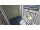 Private screened balcony overlooks parking lot and some landscaping at 2201 Bay Club Cir, Tampa, FL 33607